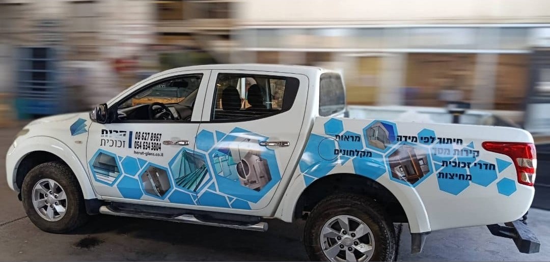 Full-body graphic sticker work on a pickup truck.